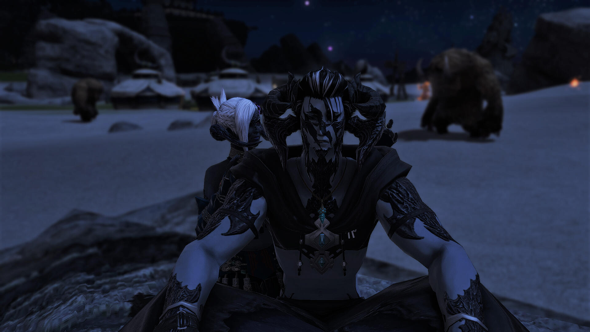 A Xaelan man in a hooded shawl with dark hair sits on a rock in the desert, an older Xaelan woman with dark blue skin and white braided hair kneeling behind him, her arms raised towards the man's horns. The man looks sad and the woman looks affectionate.